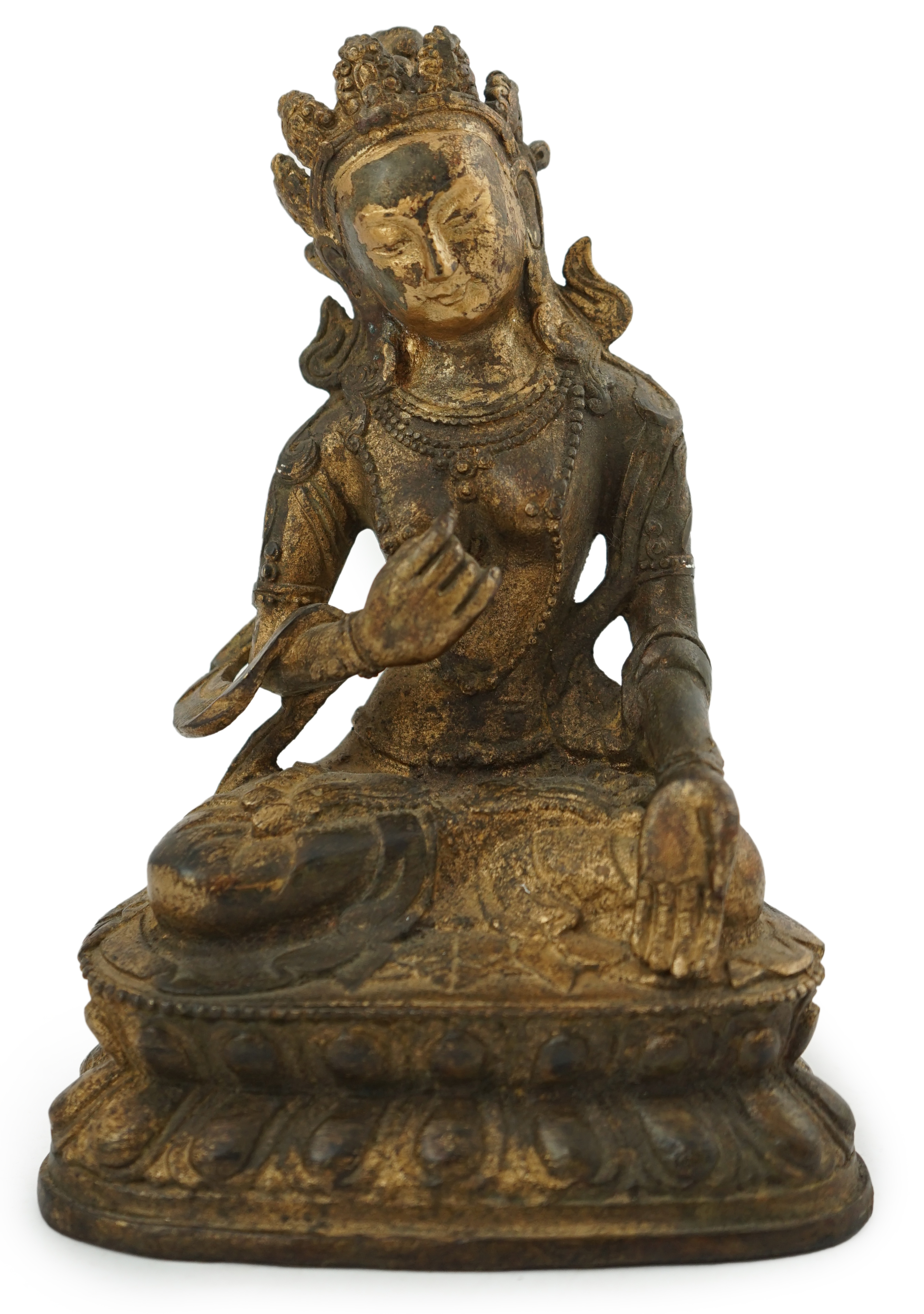 A Tibetan gilt bronze figure of seated Tara, on a double lotus throne, 16.5cm high. Condition - good